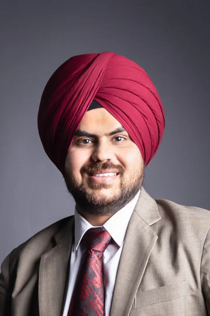 A man with a turban on his head.