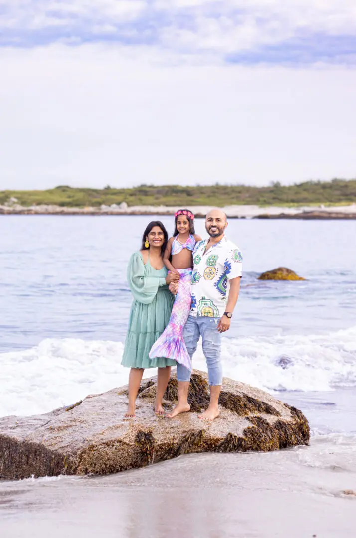 A family posing for a picture on the beach