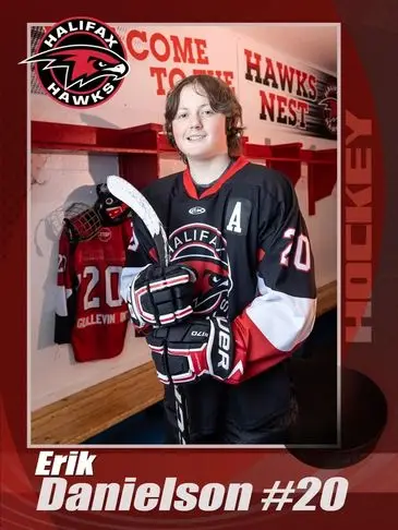 A young hockey player in the locker room.