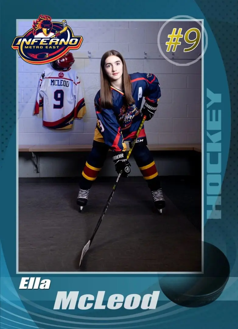 A girl in blue and red hockey uniform posing for the camera.