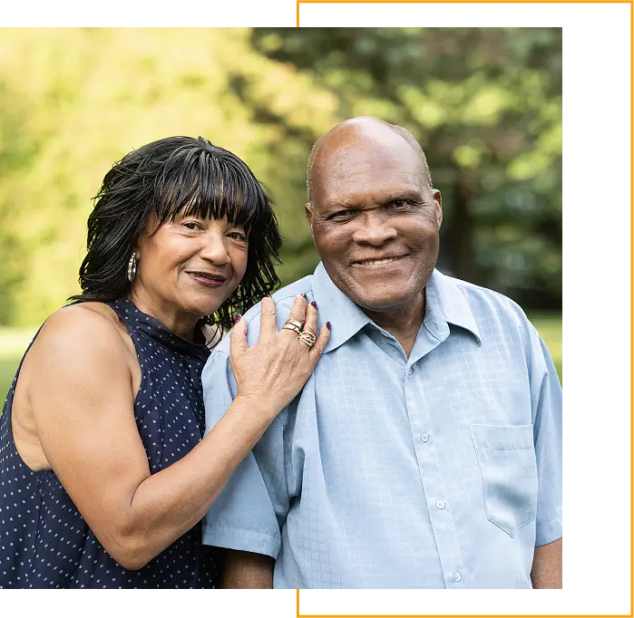 A man and woman posing for the camera.